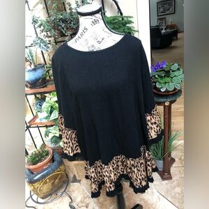 New with tags fun tunic with animal print accents.